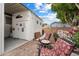 Cozy backyard with brick patio and mature landscaping, perfect for outdoor living at 5534 E Player Pl, Mesa, AZ 85215
