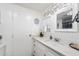Bright bathroom featuring a stylish vanity with undermount sink and elegant mirror detail at 5534 E Player Pl, Mesa, AZ 85215