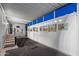 Spacious carport with artwork display and stairway access to the home's entry area at 5534 E Player Pl, Mesa, AZ 85215