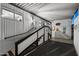 Covered carport area with stairway access to the home and decorative wall art at 5534 E Player Pl, Mesa, AZ 85215