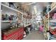 Organized garage space with ample shelving, storage, and workspace for hobbies and projects at 5534 E Player Pl, Mesa, AZ 85215