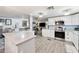 Open concept kitchen features stainless steel appliances and quartz countertops at 5534 E Player Pl, Mesa, AZ 85215