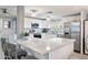 The renovated kitchen features stainless steel appliances, quartz countertops, and a backsplash at 5534 E Player Pl, Mesa, AZ 85215