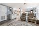 Spacious living area with recliner seating and open access to the kitchen at 5534 E Player Pl, Mesa, AZ 85215