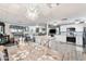 Open-concept living space with modern kitchen, dining area, and comfortable seating at 5534 E Player Pl, Mesa, AZ 85215