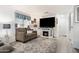Comfortable living room with a cozy fireplace, plush seating, and warm lighting at 5534 E Player Pl, Mesa, AZ 85215