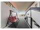 The covered patio features a sitting swing, stairwell, and access to the home at 5534 E Player Pl, Mesa, AZ 85215