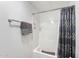 Clean and functional shower with gray accents, complemented by a decorative shower curtain at 5534 E Player Pl, Mesa, AZ 85215
