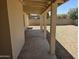 View of covered back patio overlooking large backyard area, great for entertaining or relaxing at 5608 W Carol Ave, Glendale, AZ 85302