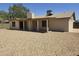 Home featuring a large backyard with a covered patio, ideal for relaxation and leisure at 5608 W Carol Ave, Glendale, AZ 85302