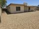 Spacious backyard with easy to maintain gravel landscaping and block fence for privacy at 5608 W Carol Ave, Glendale, AZ 85302