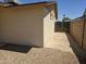Backyard corner featuring concrete pad, block fence and gravel for low maintenance landscaping at 5608 W Carol Ave, Glendale, AZ 85302