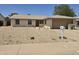 Charming single-story home featuring a low-maintenance desert landscape and inviting front entrance at 5608 W Carol Ave, Glendale, AZ 85302