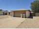Home featuring two-car garage and driveway with additional parking and desert landscaping at 5608 W Carol Ave, Glendale, AZ 85302