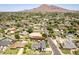 Stunning aerial view of a desert community with lush landscaping and mountain views in the background on a sunny day at 6196 E Calle Camelia --, Scottsdale, AZ 85251