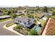 Aerial view of the property showcasing the home's backyard pool, mountain views and surrounding neighborhood at 6196 E Calle Camelia --, Scottsdale, AZ 85251