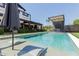 Lounge in style by the pool with a sleek waterfall feature in a luxurious outdoor setting at 6196 E Calle Camelia --, Scottsdale, AZ 85251