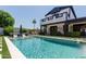 Inviting pool area perfect for relaxation, complete with lush landscaping and a waterfall feature at 6196 E Calle Camelia --, Scottsdale, AZ 85251