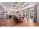Well-lit dining room with a large table, beverage bar, and doors leading to the backyard at 6196 E Calle Camelia --, Scottsdale, AZ 85251