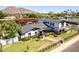 Stunning aerial view of a modern farmhouse-style home with manicured lawn and lush landscaping at 6196 E Calle Camelia --, Scottsdale, AZ 85251