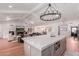 Open floor plan with kitchen island in the foreground and living area with fireplace in the background at 6196 E Calle Camelia --, Scottsdale, AZ 85251