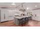Bright, open kitchen features a large island with seating and modern, stainless steel appliances at 6196 E Calle Camelia --, Scottsdale, AZ 85251