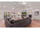 Inviting living room area with a cozy fireplace, plush seating, and sliding glass doors to the outside at 6196 E Calle Camelia --, Scottsdale, AZ 85251