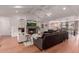 Spacious living room with fireplace, a cozy seating area, and views into the dining area at 6196 E Calle Camelia --, Scottsdale, AZ 85251