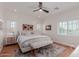 Airy bedroom with a ceiling fan, plush rug, and many windows offering an abundance of natural light at 6196 E Calle Camelia --, Scottsdale, AZ 85251