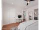 Bright bedroom features a ceiling fan, sleek desk area and ensuite bathroom with vanity at 6196 E Calle Camelia --, Scottsdale, AZ 85251