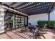 Covered patio area with brick flooring, cozy seating and a fire pit for outdoor entertainment at 6196 E Calle Camelia --, Scottsdale, AZ 85251