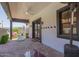 Outdoor patio with ceiling fan, lighting, brick flooring, and access to the backyard at 6196 E Calle Camelia --, Scottsdale, AZ 85251