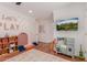 Bright playroom with play kitchen, TV for entertaining, and an open layout for  at 6196 E Calle Camelia --, Scottsdale, AZ 85251