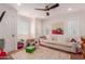 Bright playroom with daybed, lots of natural light, and an open layout for entertaining at 6196 E Calle Camelia --, Scottsdale, AZ 85251