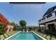Stunning pool with a waterfall feature, surrounded by vibrant bougainvillea and manicured landscaping at 6196 E Calle Camelia --, Scottsdale, AZ 85251
