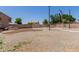 Expansive backyard with desert landscaping, fenced pool area, and potential for outdoor activities at 6276 N 75Th Ln, Glendale, AZ 85303