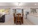 Dining area filled with natural light from the bay window, adjacent to the kitchen at 6276 N 75Th Ln, Glendale, AZ 85303