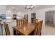 Inviting dining area with wooden table, seamlessly connected to the kitchen at 6276 N 75Th Ln, Glendale, AZ 85303