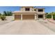 Inviting two-story home with a tile roof and three-car garage at 6276 N 75Th Ln, Glendale, AZ 85303