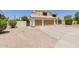 Two-story home with a three-car garage, desert landscaping and mature trees at 6276 N 75Th Ln, Glendale, AZ 85303