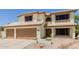 Inviting two-story home featuring a three-car garage and neutral-toned exterior at 6276 N 75Th Ln, Glendale, AZ 85303