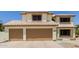 Spacious three-car garage with automatic doors and tile roof at 6276 N 75Th Ln, Glendale, AZ 85303