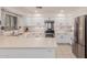 Beautiful kitchen with stainless steel appliances, white cabinets and tile flooring at 6276 N 75Th Ln, Glendale, AZ 85303