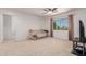 Open living room with natural light, comfortable seating and modern entertainment center at 6276 N 75Th Ln, Glendale, AZ 85303