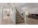 Open staircase leading to the upper level with an adjacent living room at 6276 N 75Th Ln, Glendale, AZ 85303