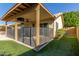 Charming backyard patio space with a covered dining area and view of the well-maintained yard at 6430 E Riverdale St, Mesa, AZ 85215