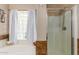 Relaxing bathroom featuring a soaking tub, separate shower, and bright natural light for a spa-like experience at 6430 E Riverdale St, Mesa, AZ 85215