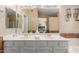 Well-lit bathroom with double sinks, a large mirror, and ample counter space, offering comfort and functionality at 6430 E Riverdale St, Mesa, AZ 85215