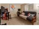 Bedroom features carpet flooring, natural light, and game machines providing a versatile space for entertainment and relaxation at 6430 E Riverdale St, Mesa, AZ 85215