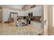 Bright kitchen boasts granite counters, stainless steel appliances, and ample white cabinetry for storage and style at 6430 E Riverdale St, Mesa, AZ 85215
